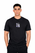 A man wearing a black Nike t-shirt