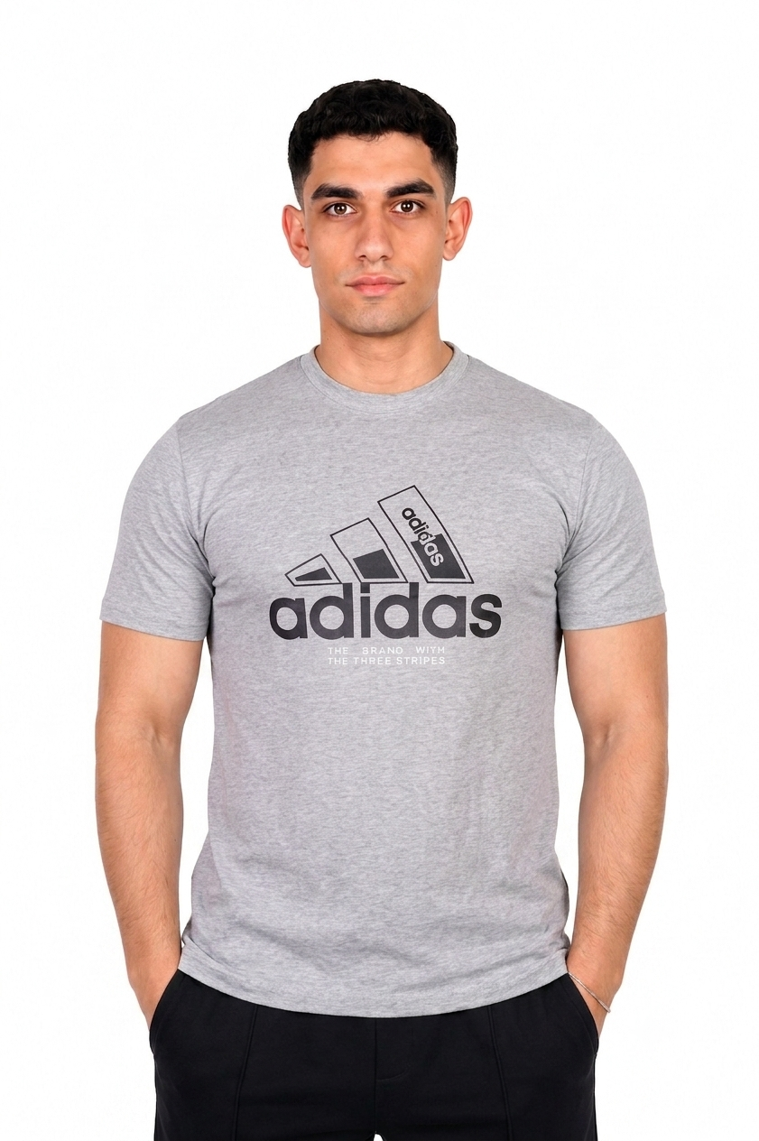A man wearing a gray Adidas t-shirt