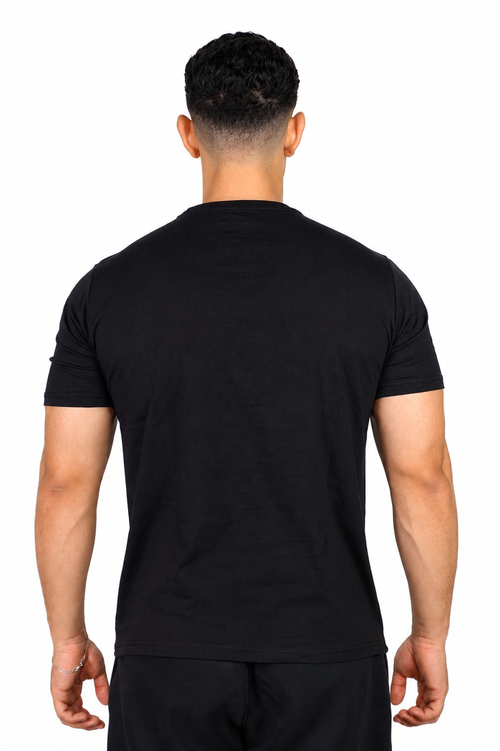 A man wearing a black Adidas t-shirt
