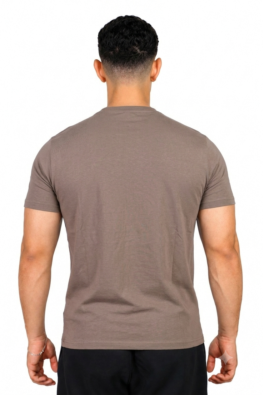 A man wearing a Taupe Adidas t-shirt