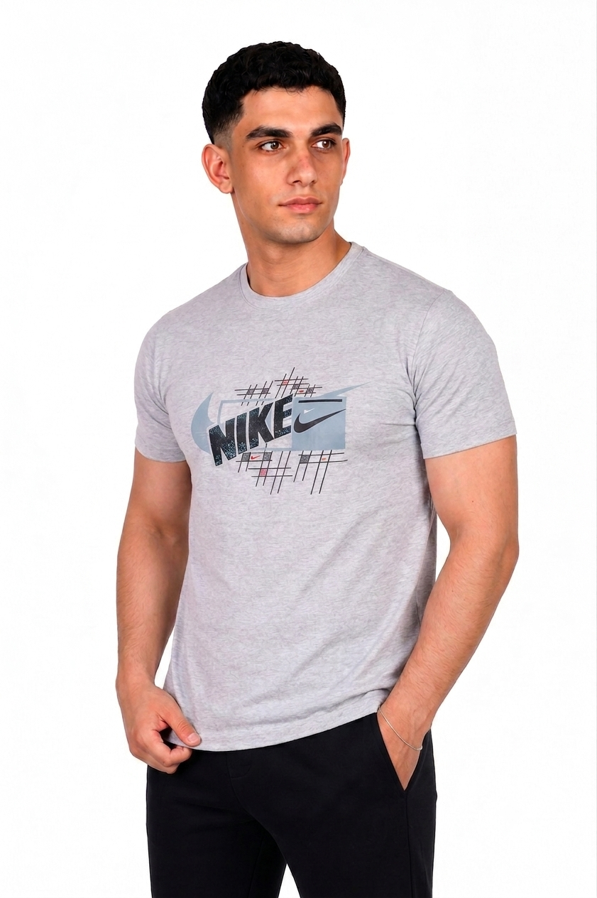 A man wearing a light gray heathered Nike t-shirt with a graphic print on the chest