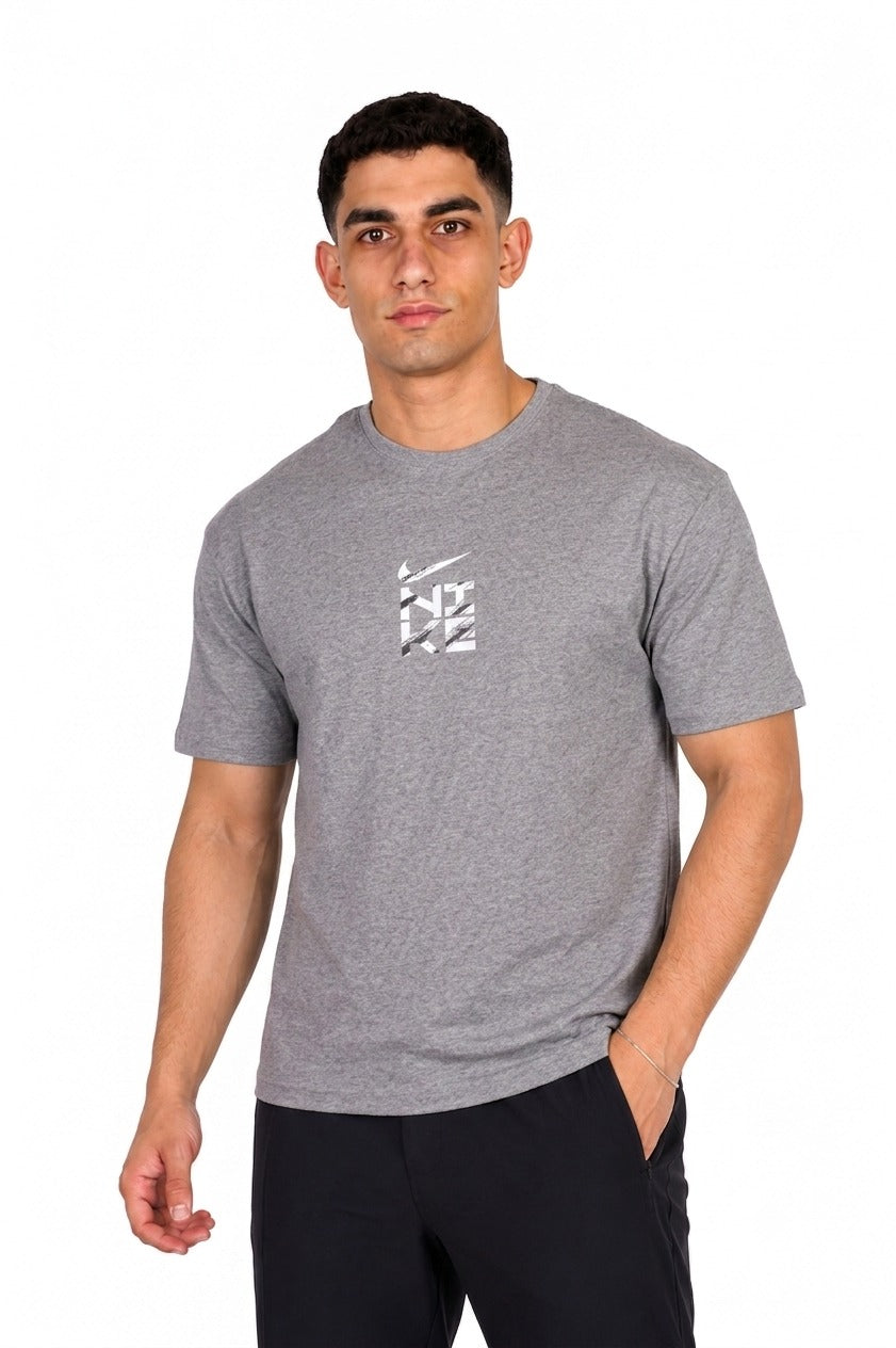 A man wearing a gray Nike t-shirt