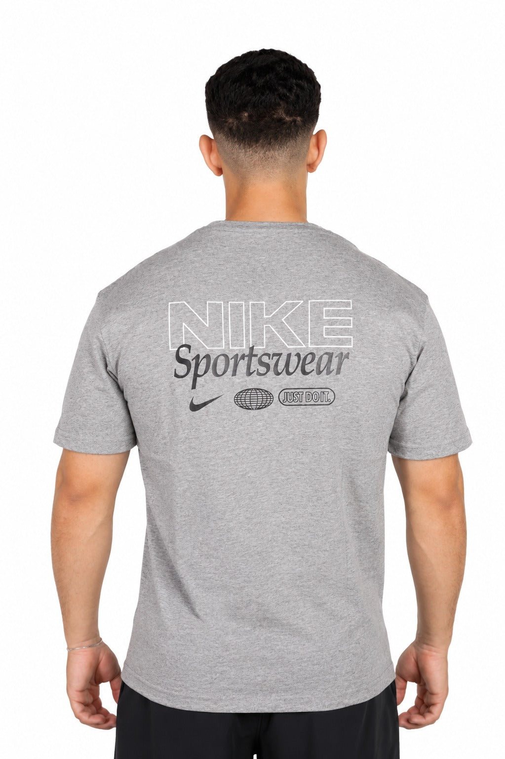 A man wearing a gray Nike t-shirt