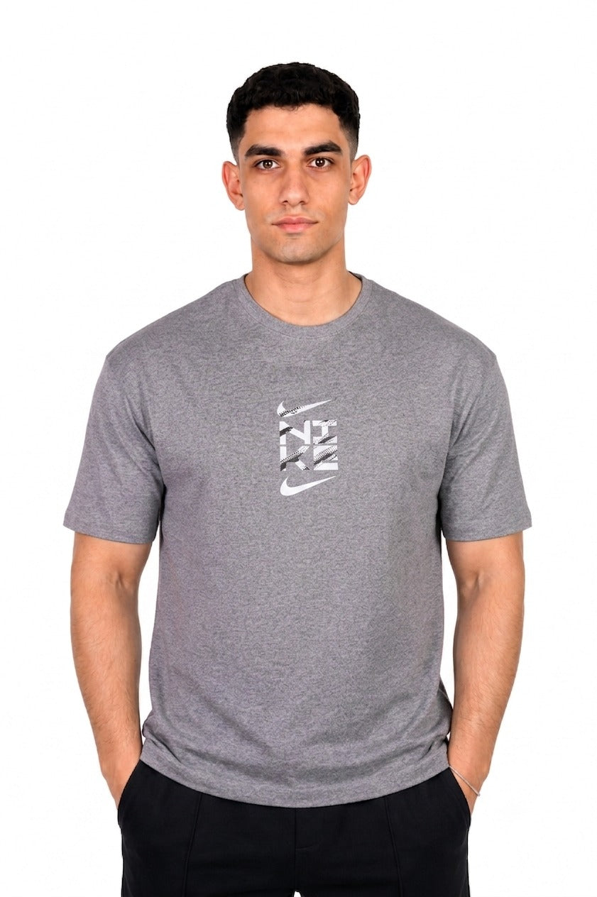 A man wearing a gray Nike t-shirt