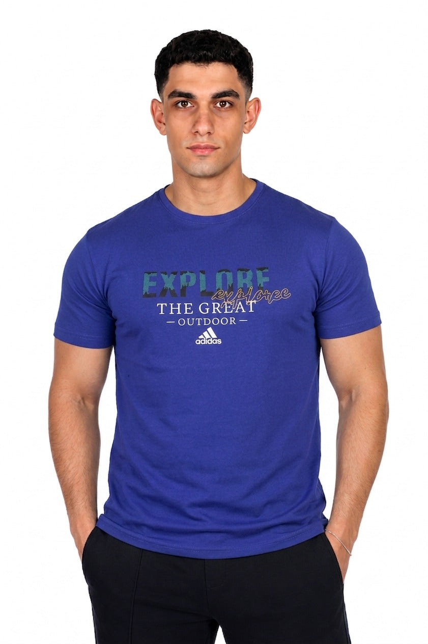 A man wearing a Blue Adidas t-shirt