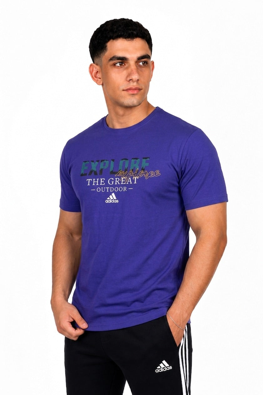 A man wearing a Blue Adidas t-shirt