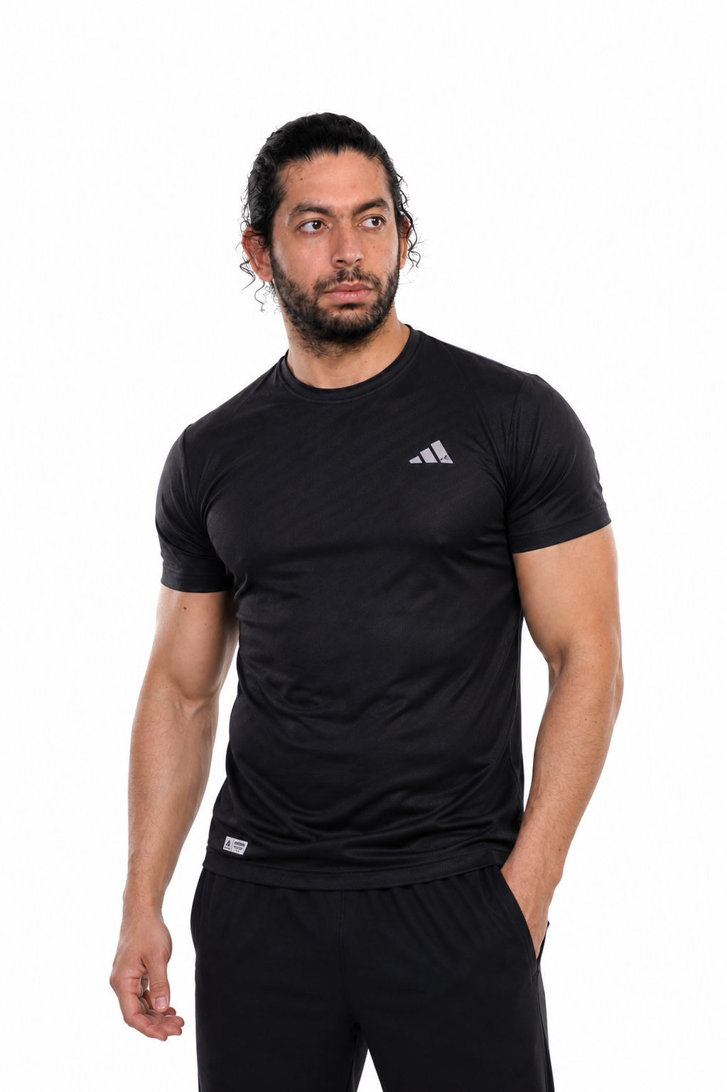 Man wearing a black Adidas t-shirt on a background