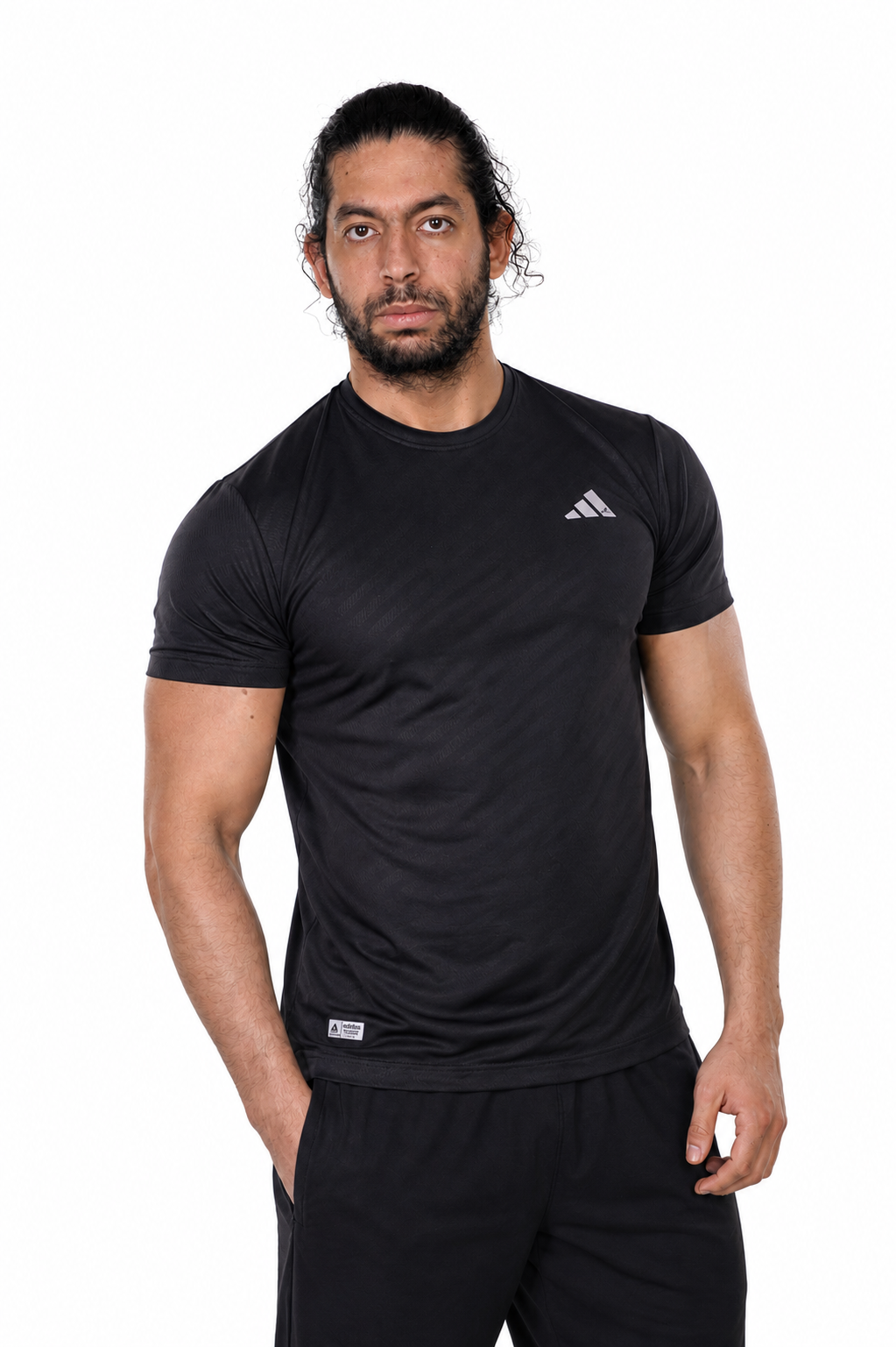 Man wearing a black Adidas t-shirt on a background