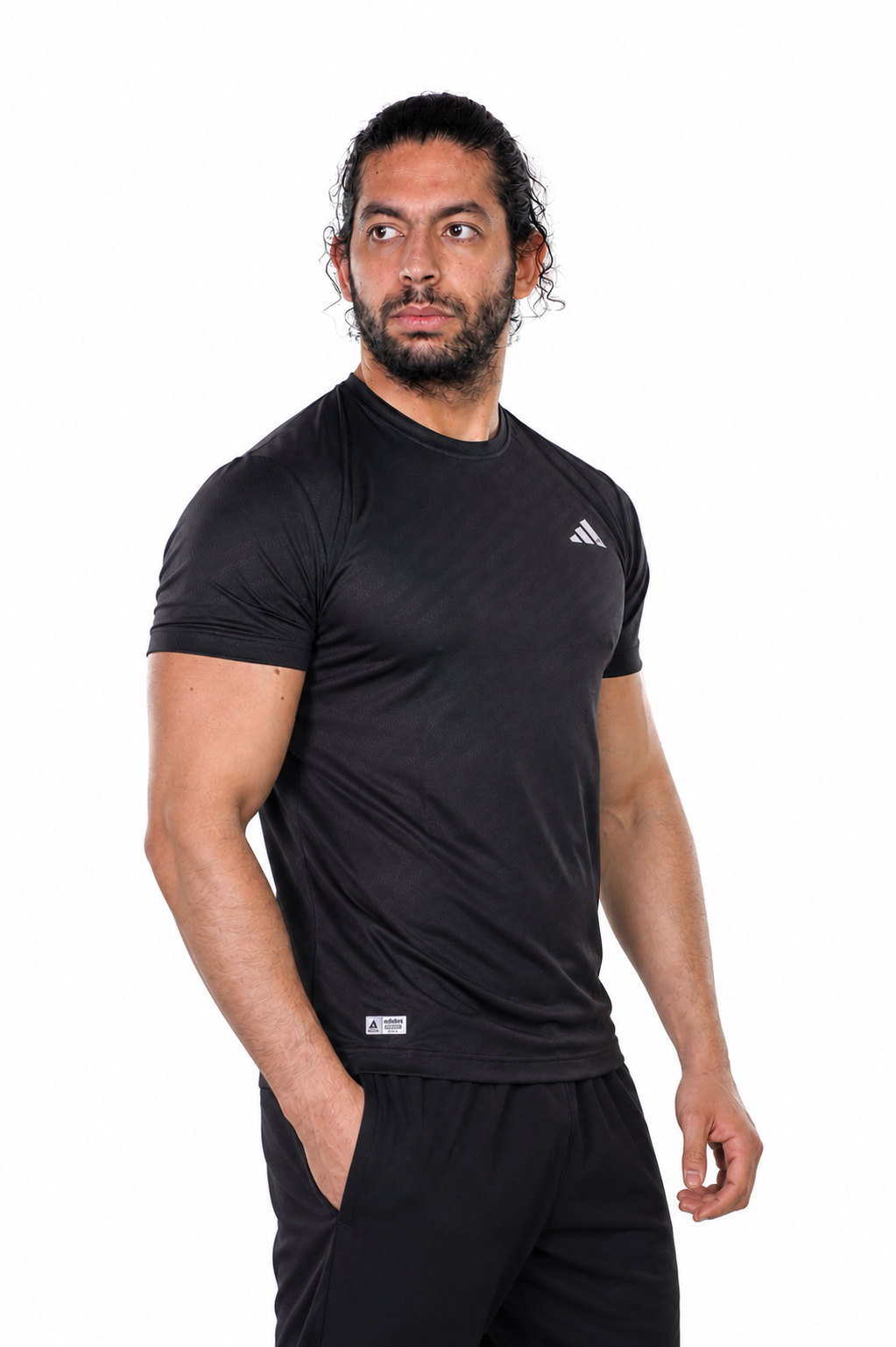 Man wearing a black Adidas t-shirt on a background