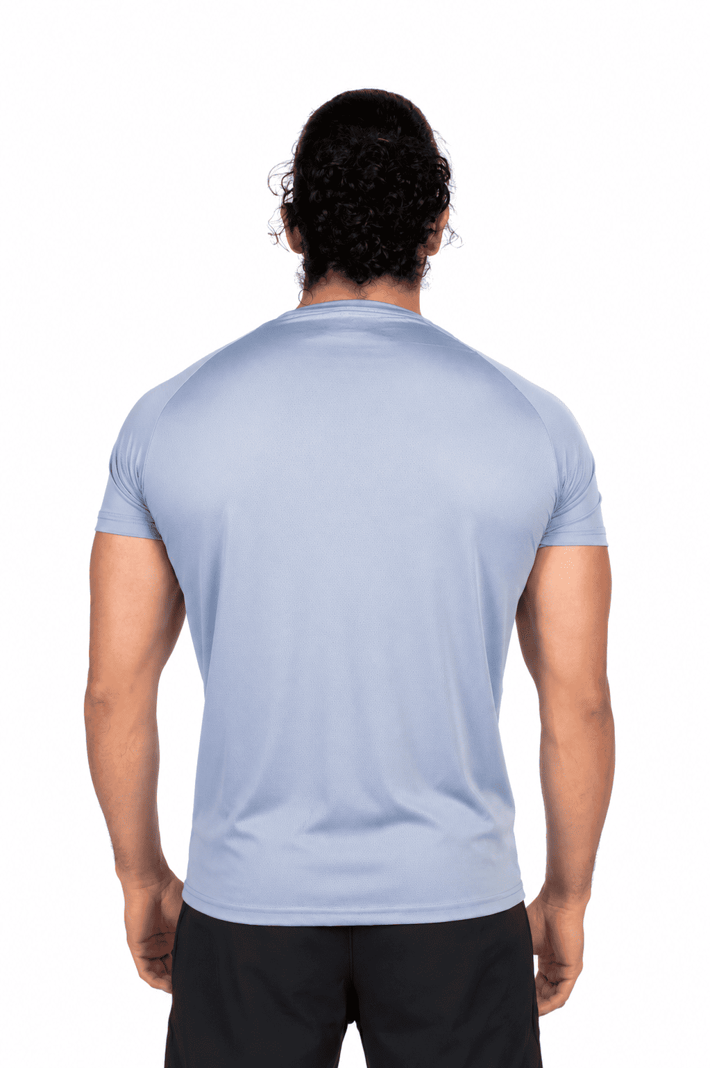Man wearing a light blue t-shirt on a white background