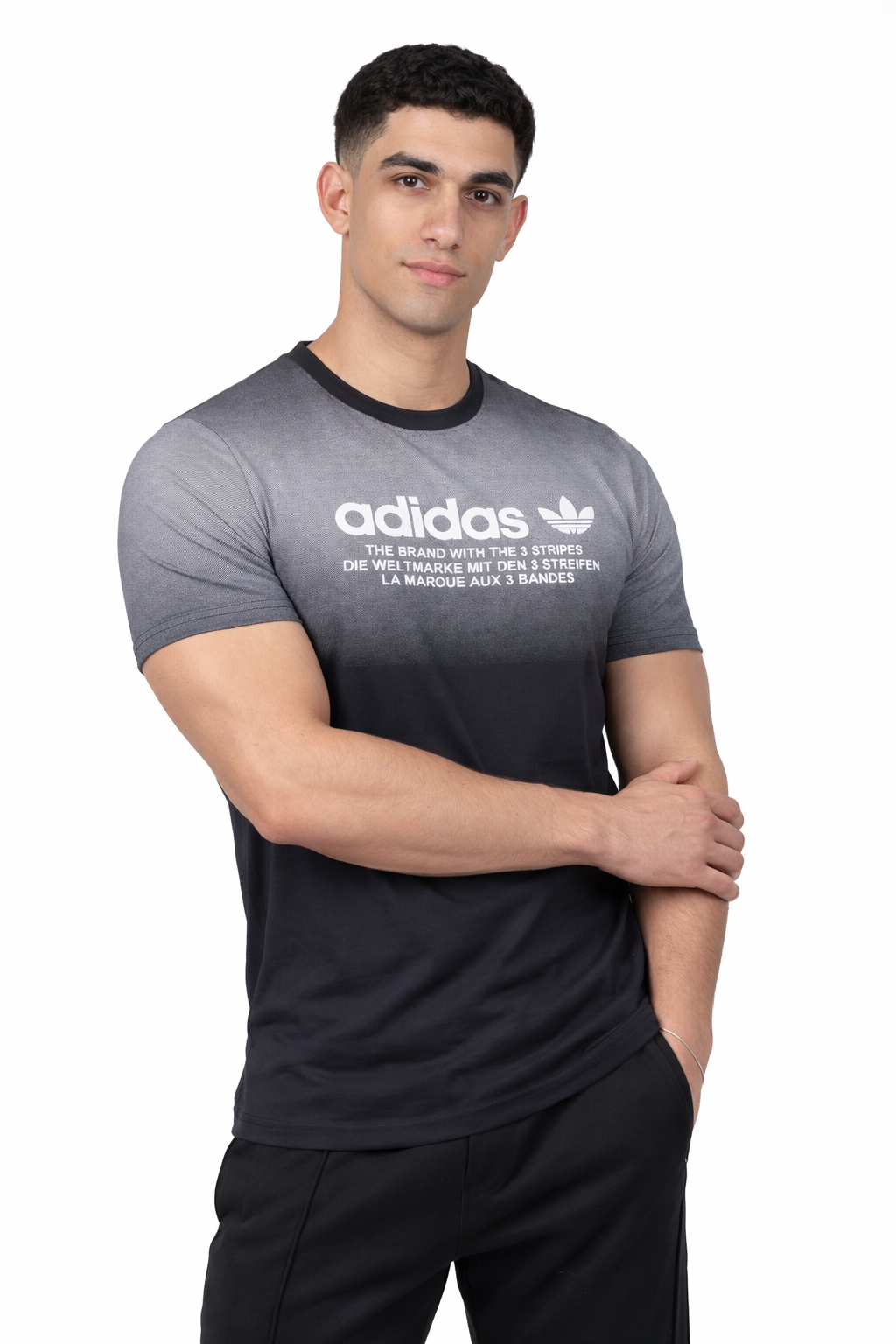 Man wearing a black Adidas t-shirt on a white background