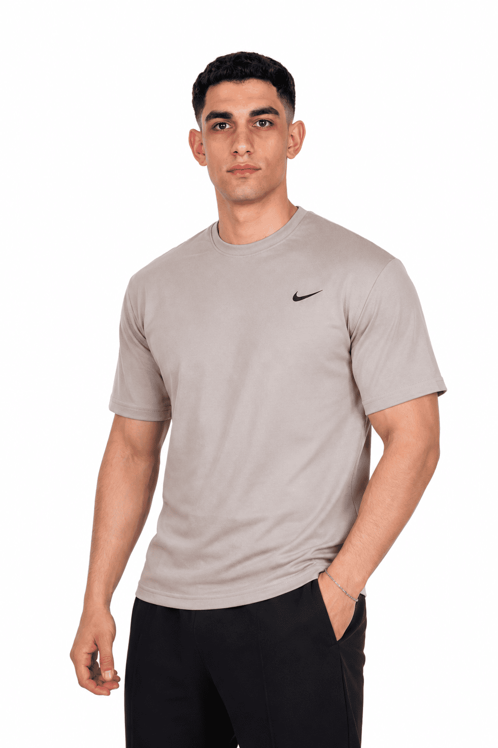 Man wearing a beige Nike t-shirt on a background