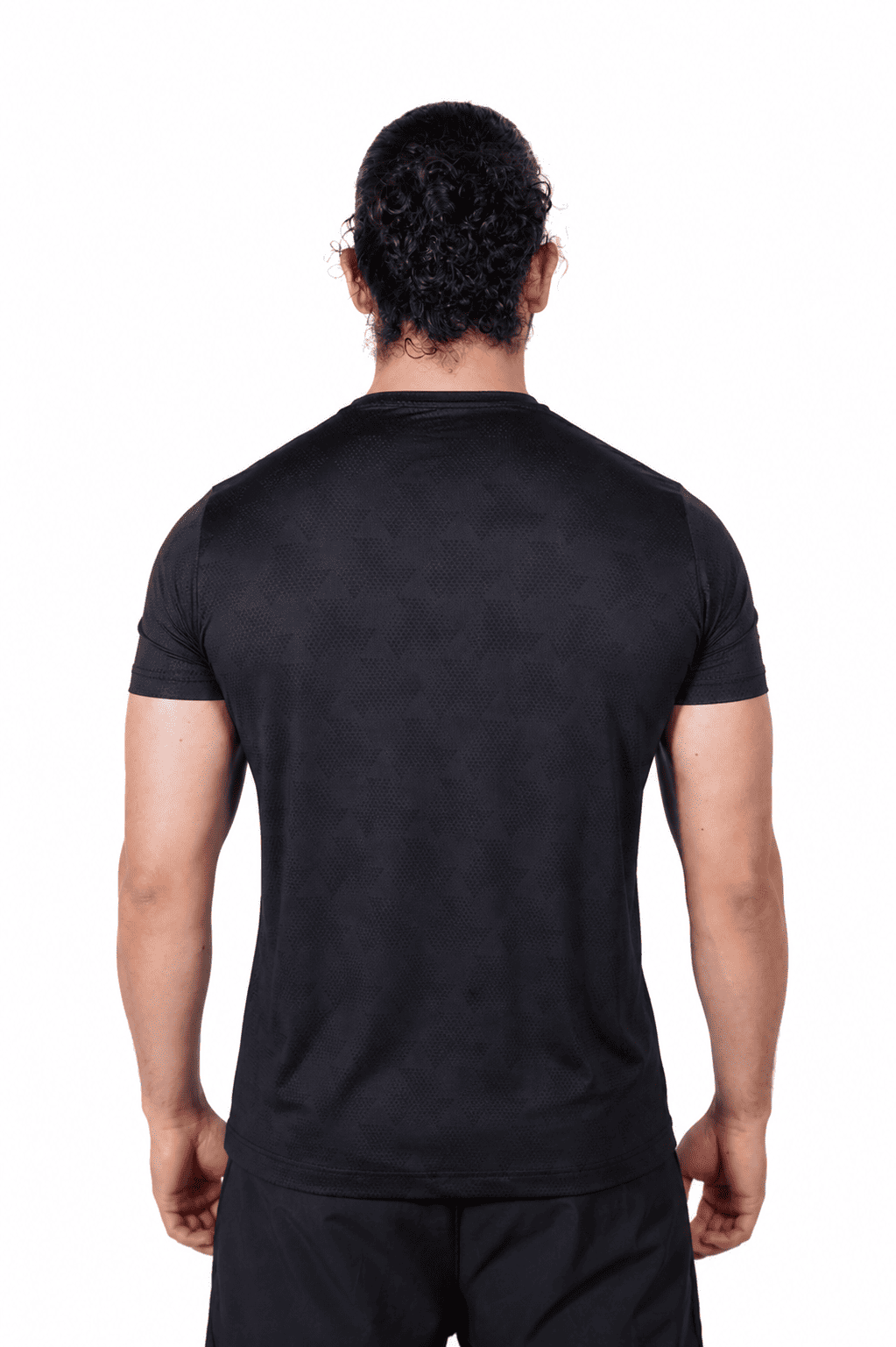Person wearing a black t-shirt on a white background
