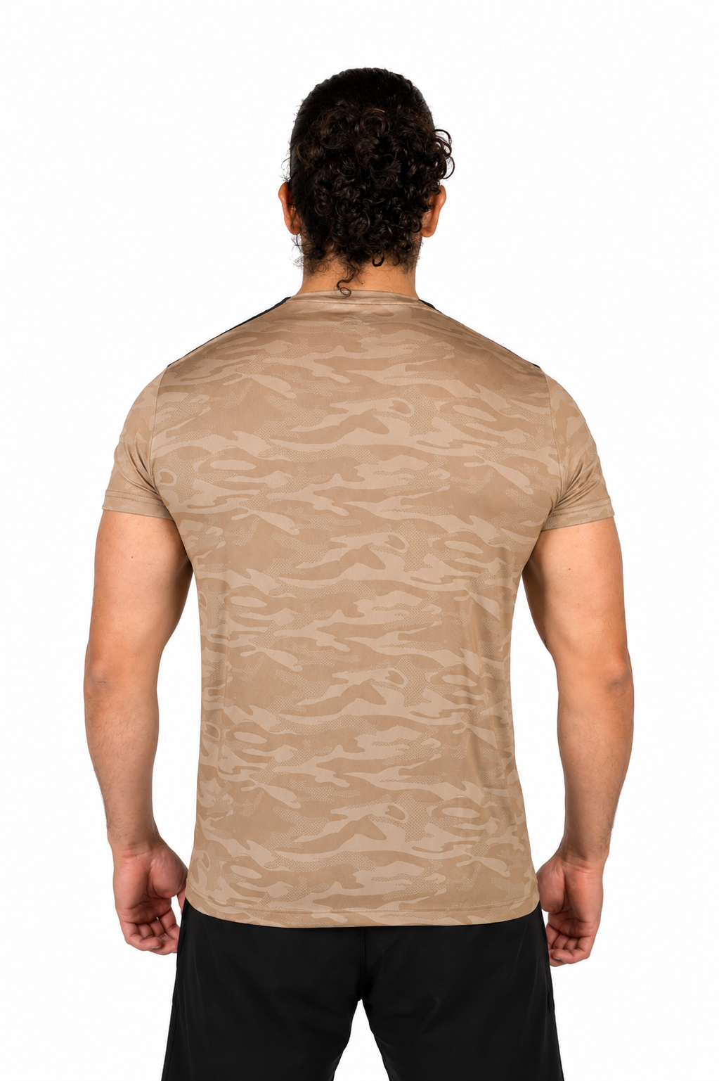 Person wearing a beige camouflage t-shirt on a background