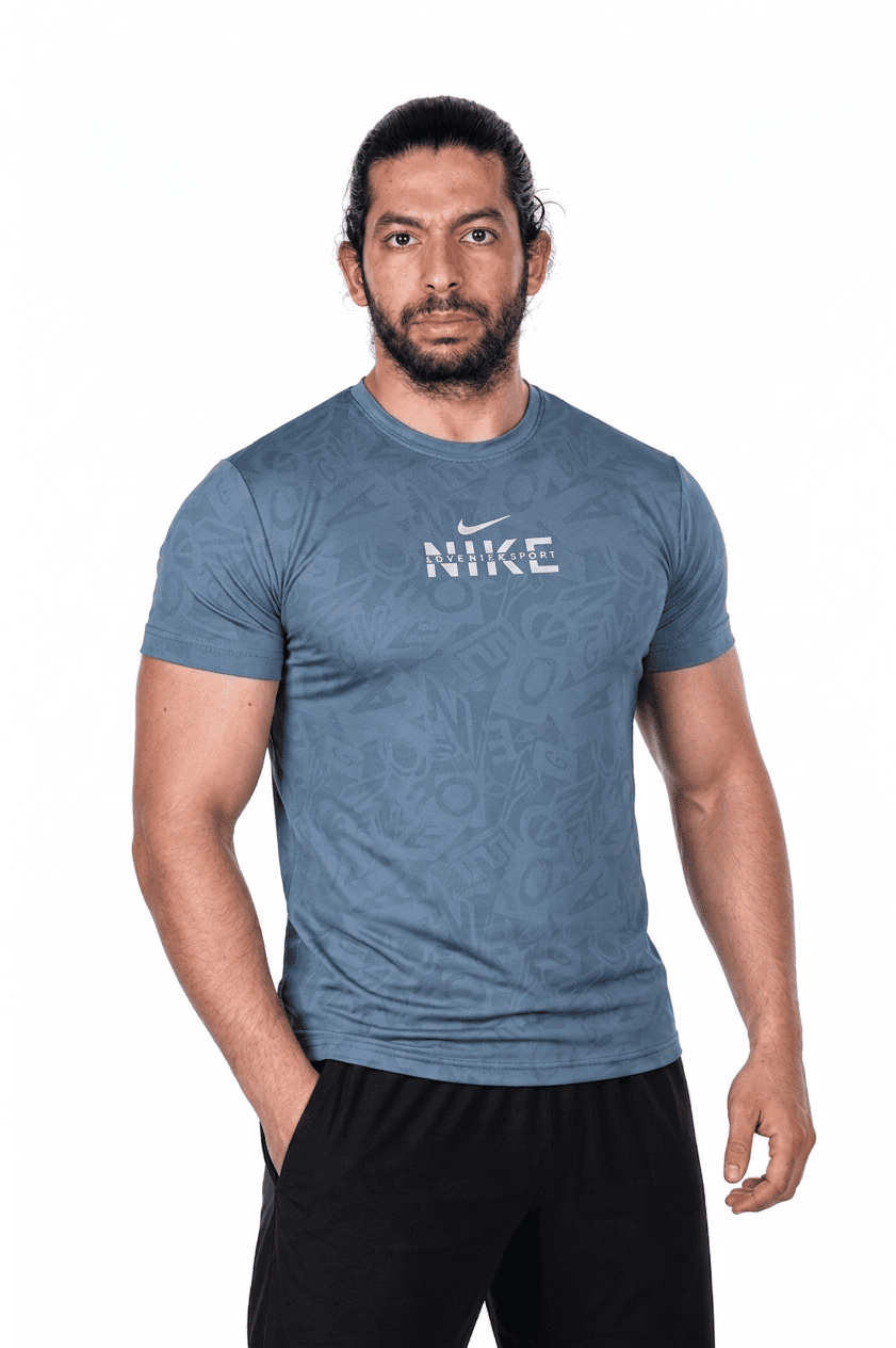 Man wearing a Turquaz Nike t-shirt on a white background