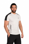 Man wearing a white and athletic shirt with Nike logo on a white background