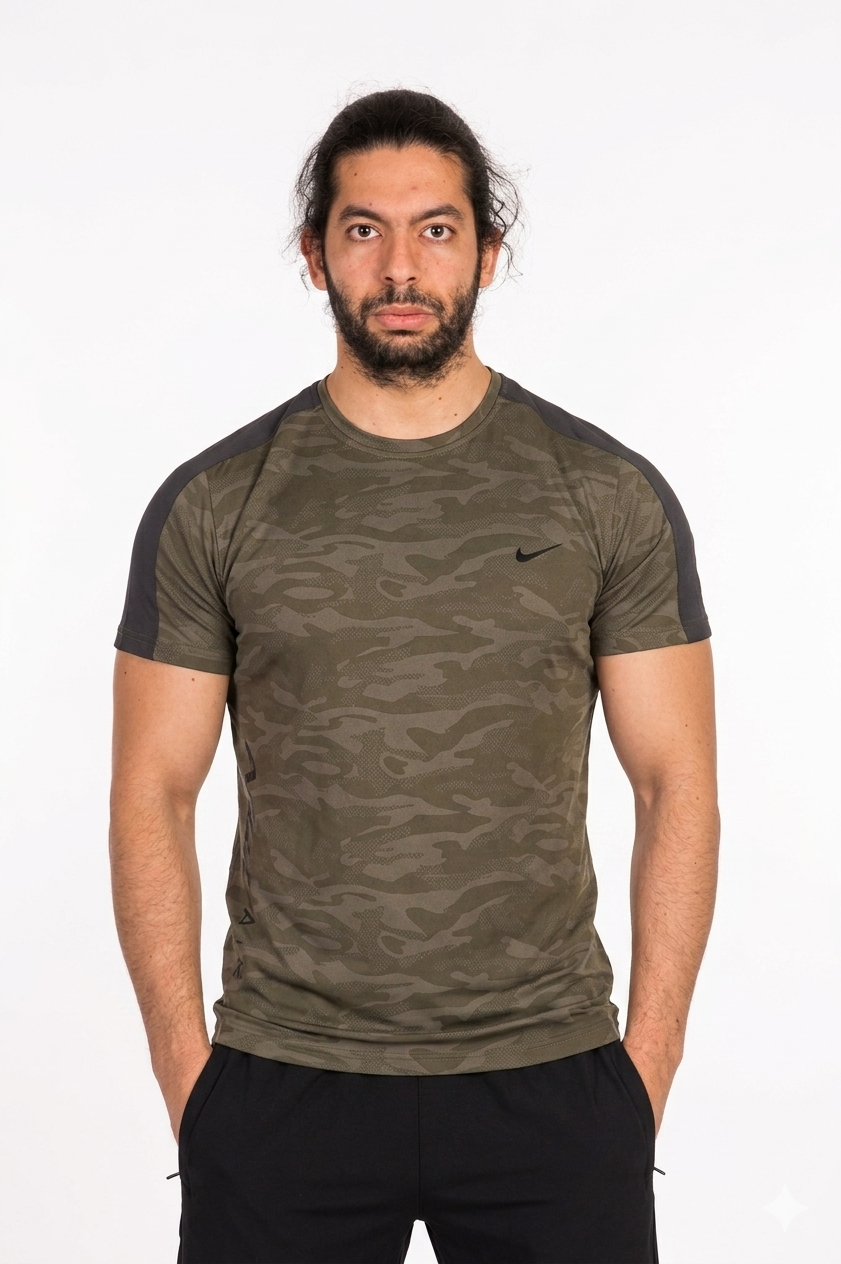 Man wearing a camouflage t-shirt with a Nike logo on a background