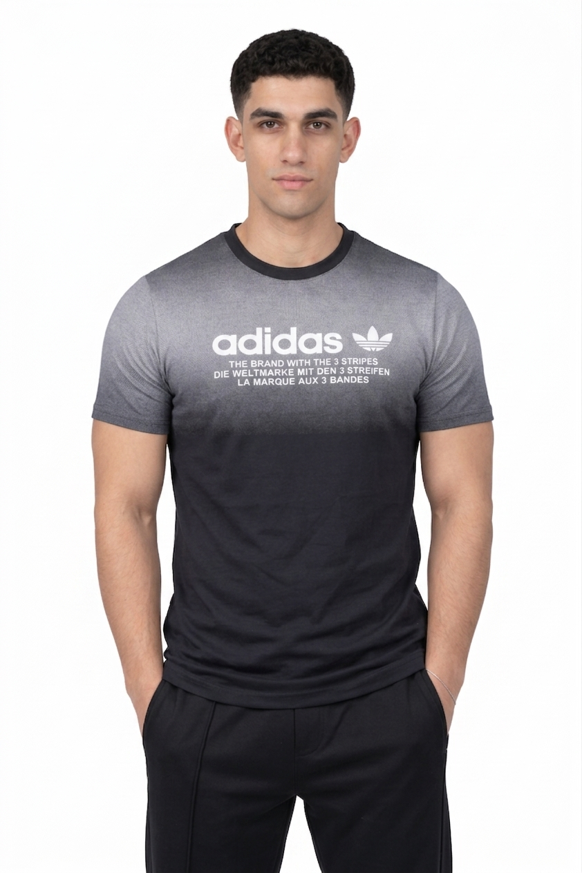 Person wearing a black Adidas t-shirt with a white logo on a white background