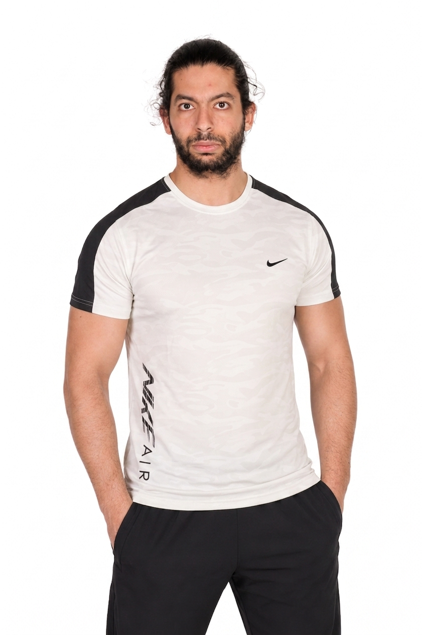 Man wearing a white Nike t-shirt with sleeves and logo on a white background