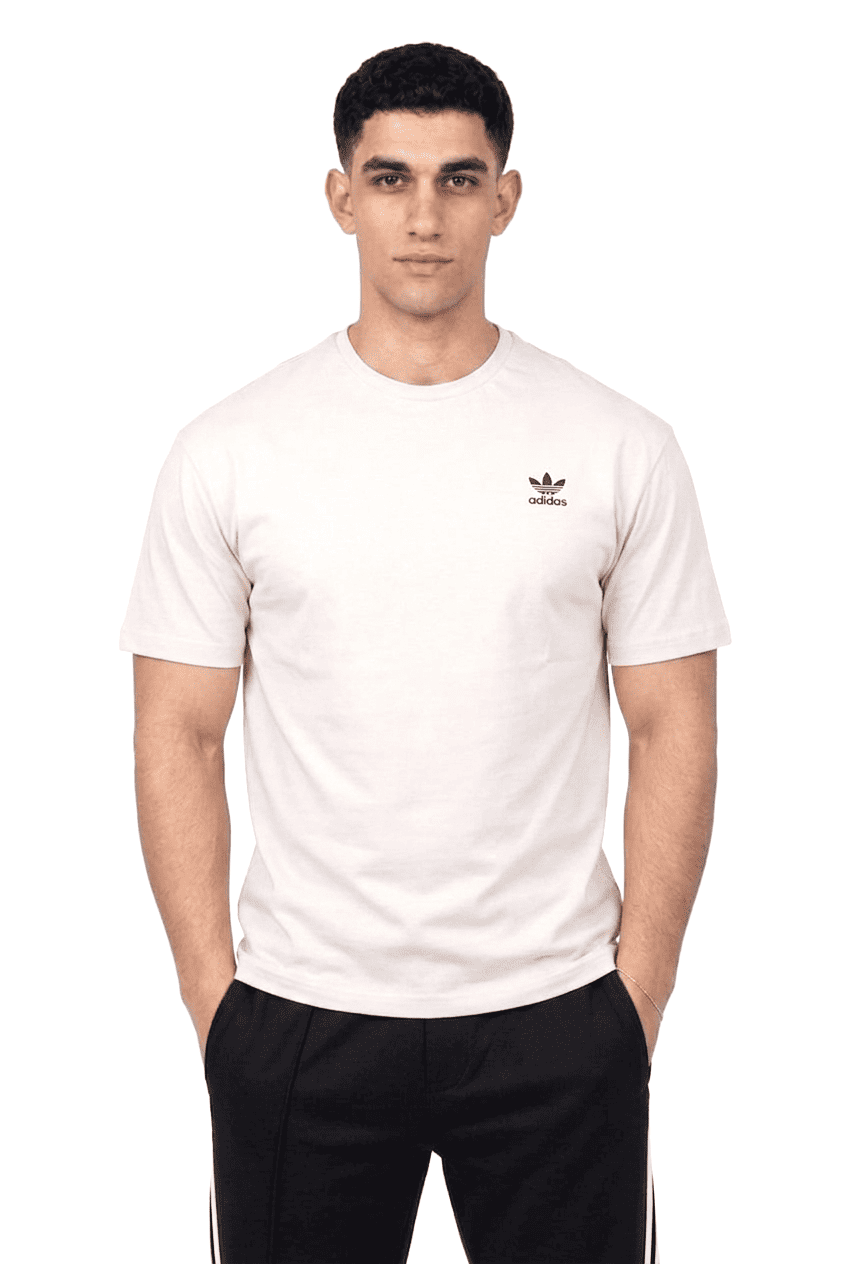 Person wearing a white Adidas t-shirt on a white background