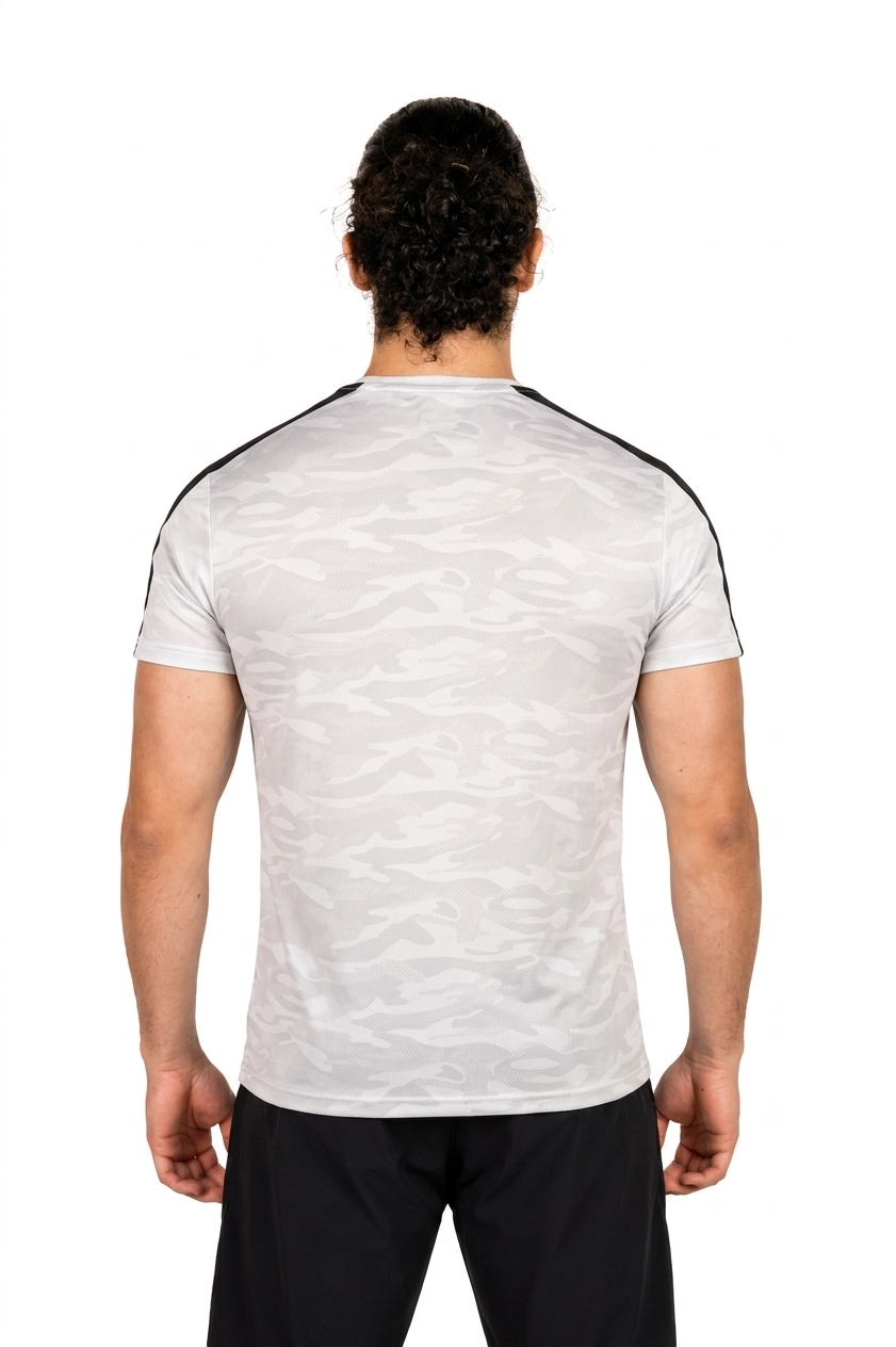 Man wearing a white athletic shirt with stripes on a white background