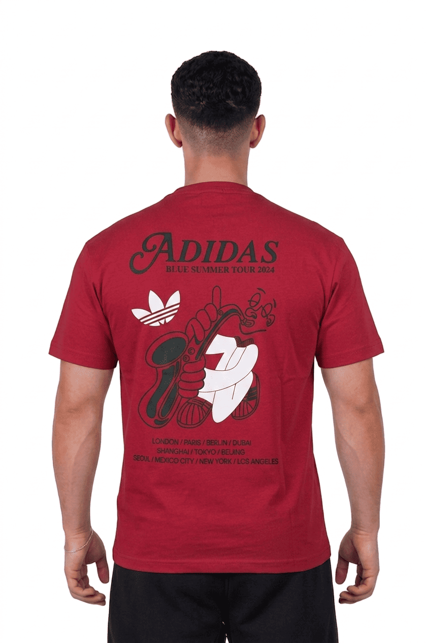Person wearing a red Adidas t-shirt with graphic designs on the back
