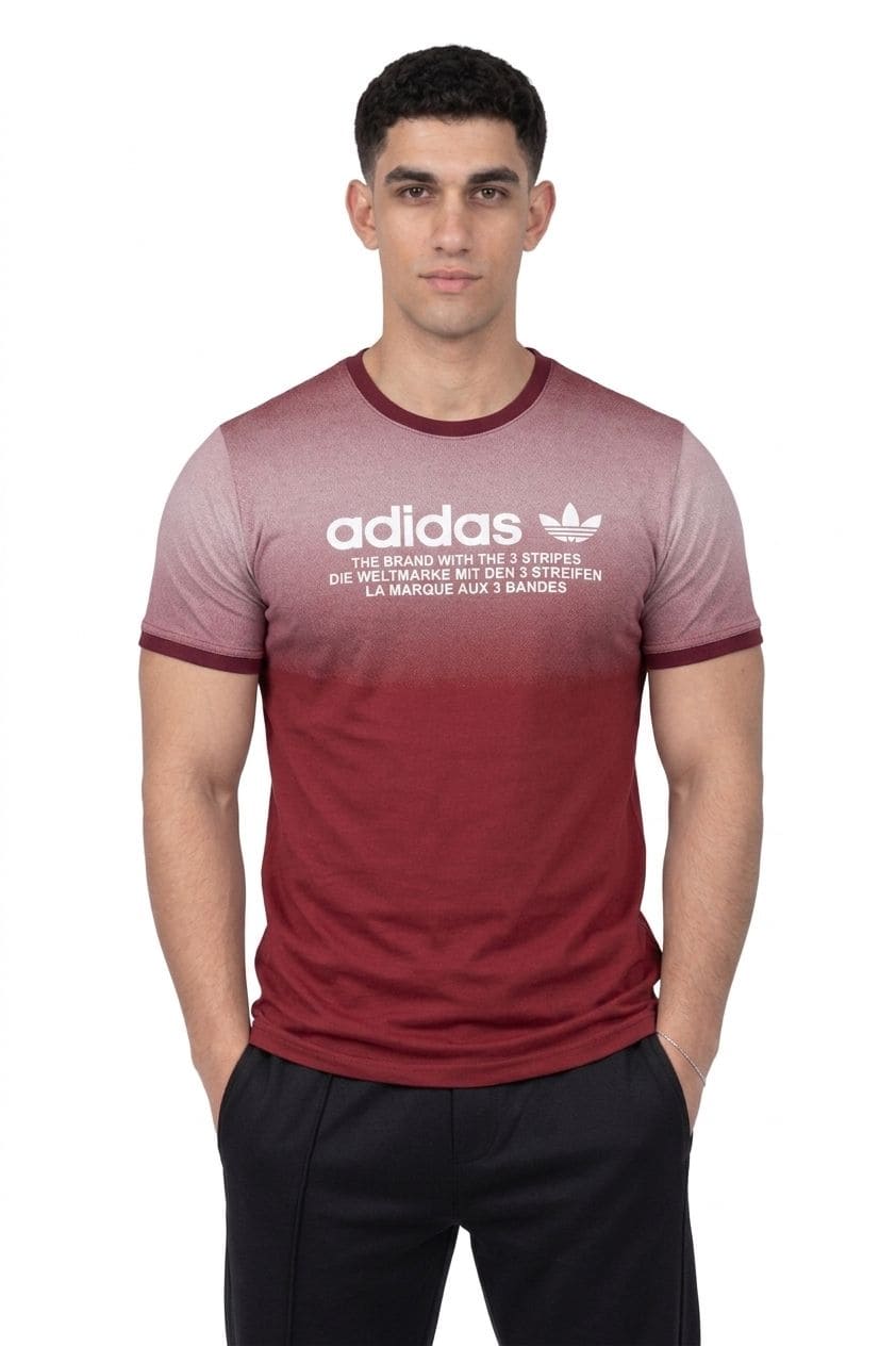 Man wearing a maroon Adidas t-shirt with a white logo on a white background