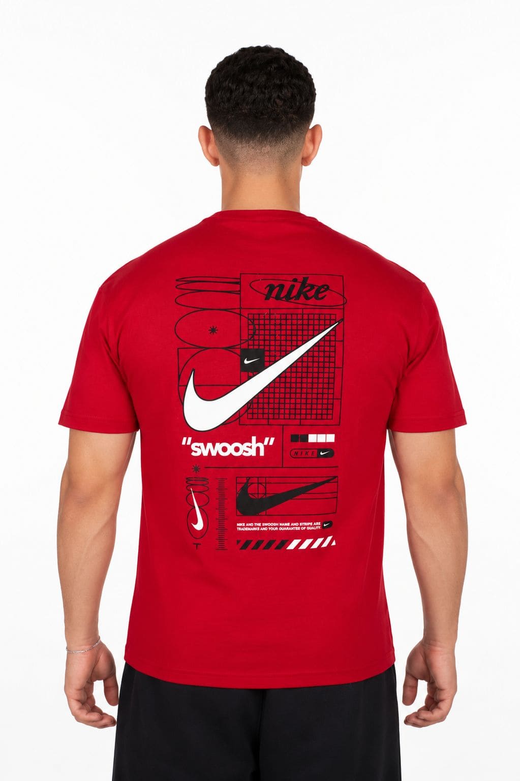 Red Nike t-shirt with branding on the back, worn by a person on a background