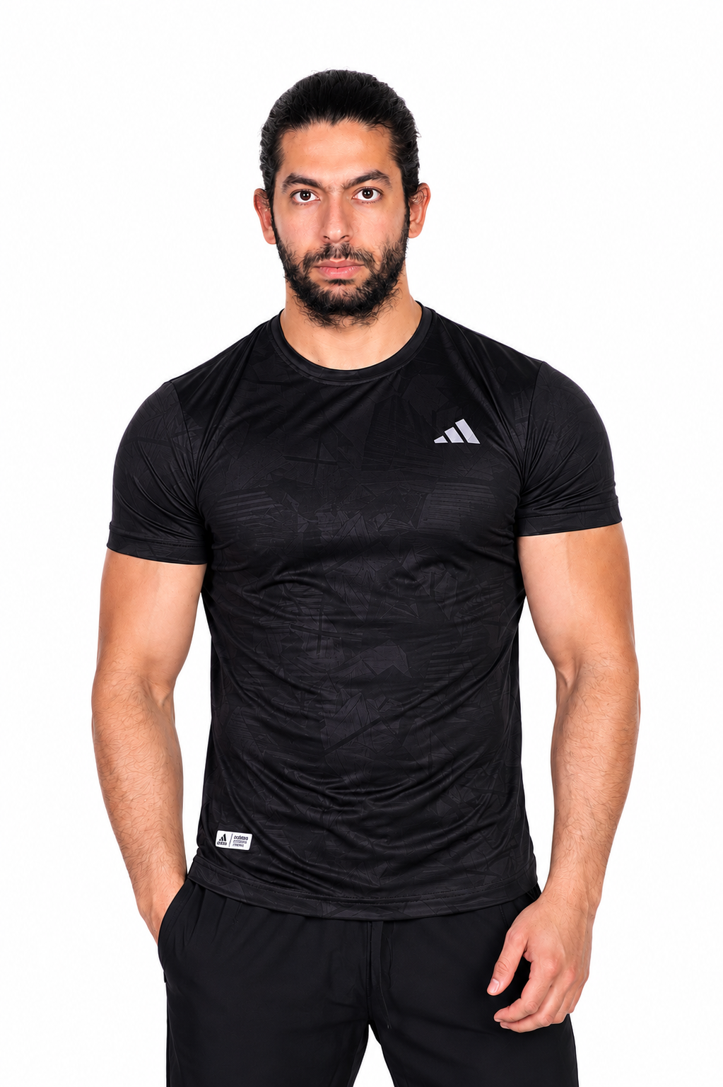 Man wearing a black Adidas t-shirt on a background