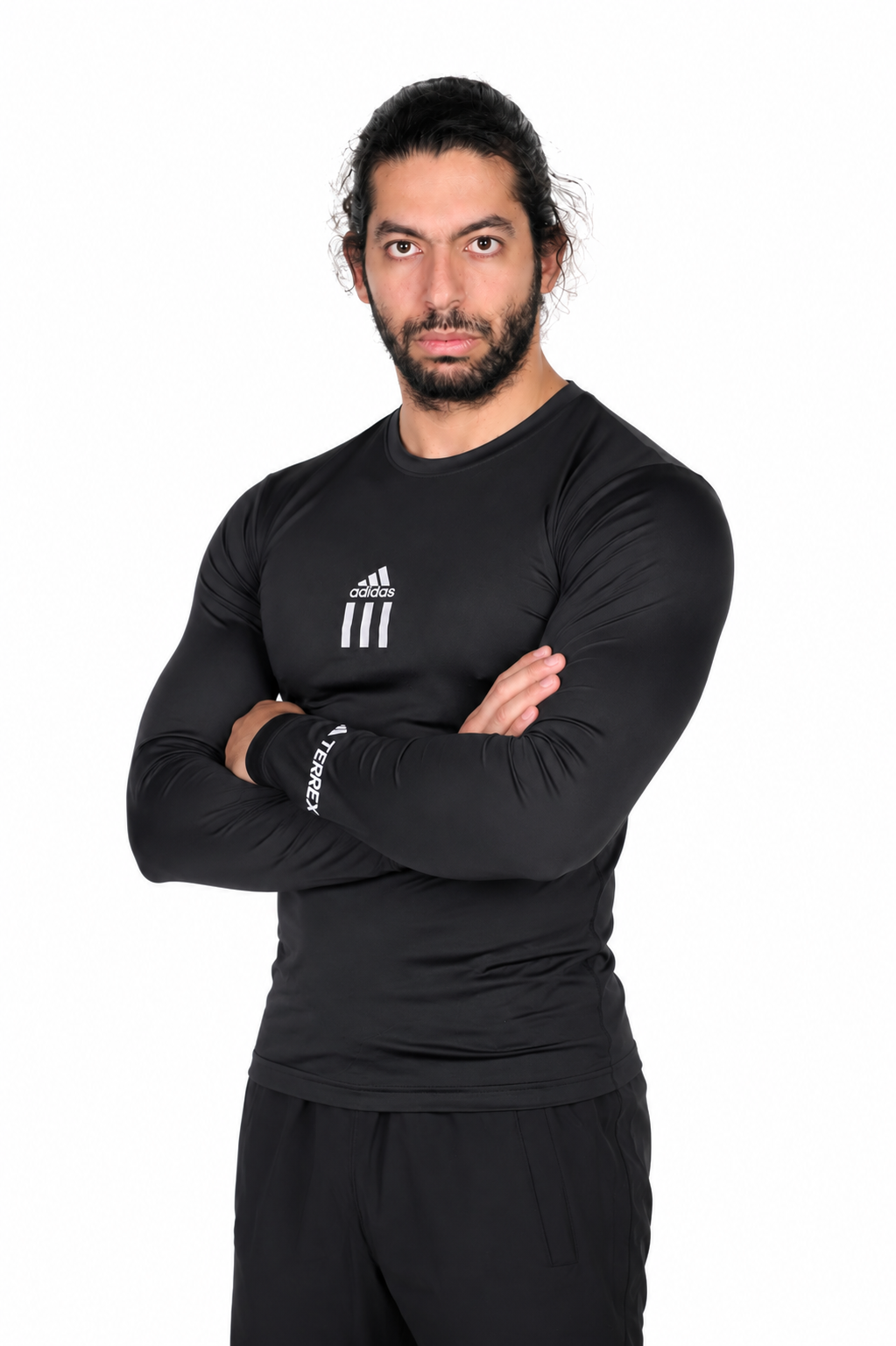 Man wearing a black Adidas long-sleeve shirt on a background