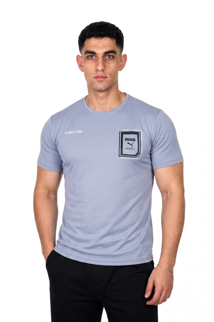 Man wearing a light blue t-shirt with a logo on a white background