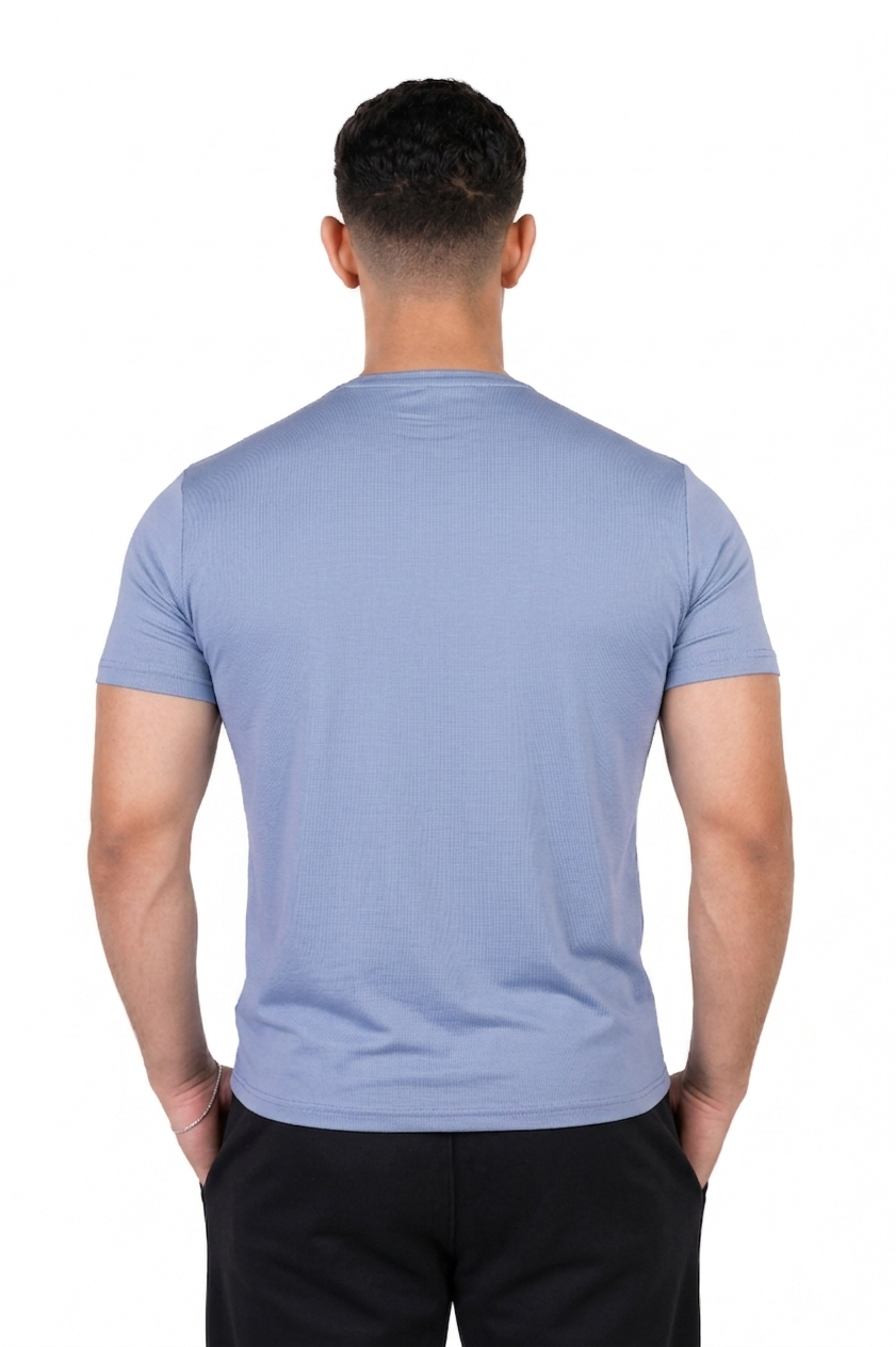 Man wearing a light blue t-shirt on a white background